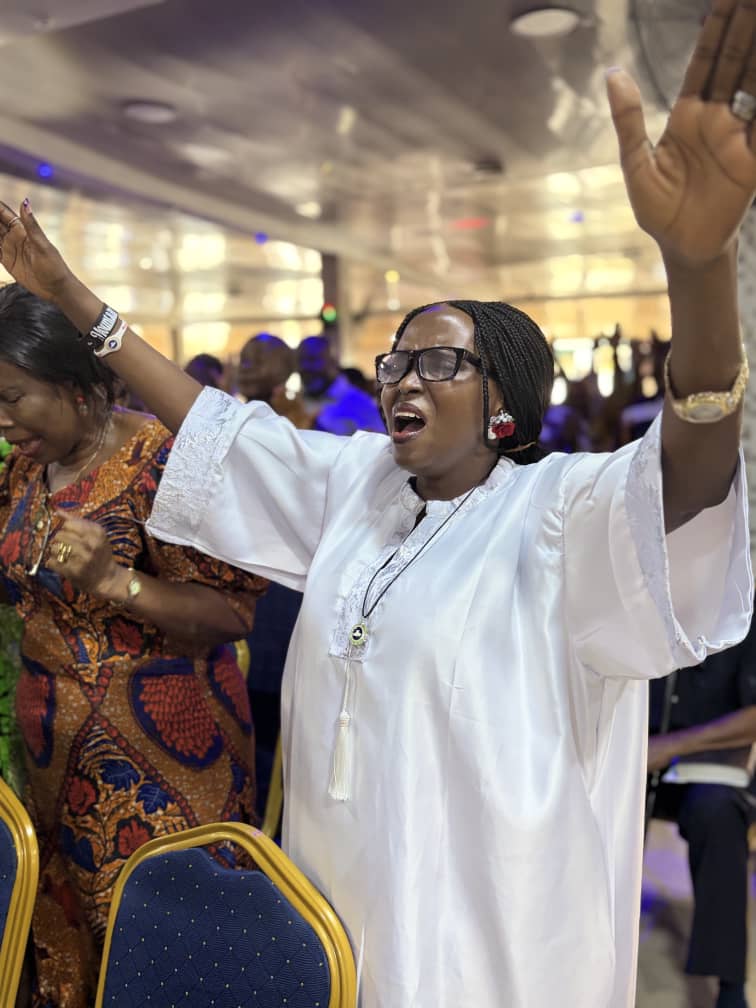 Worshippers lifting their hands in praise